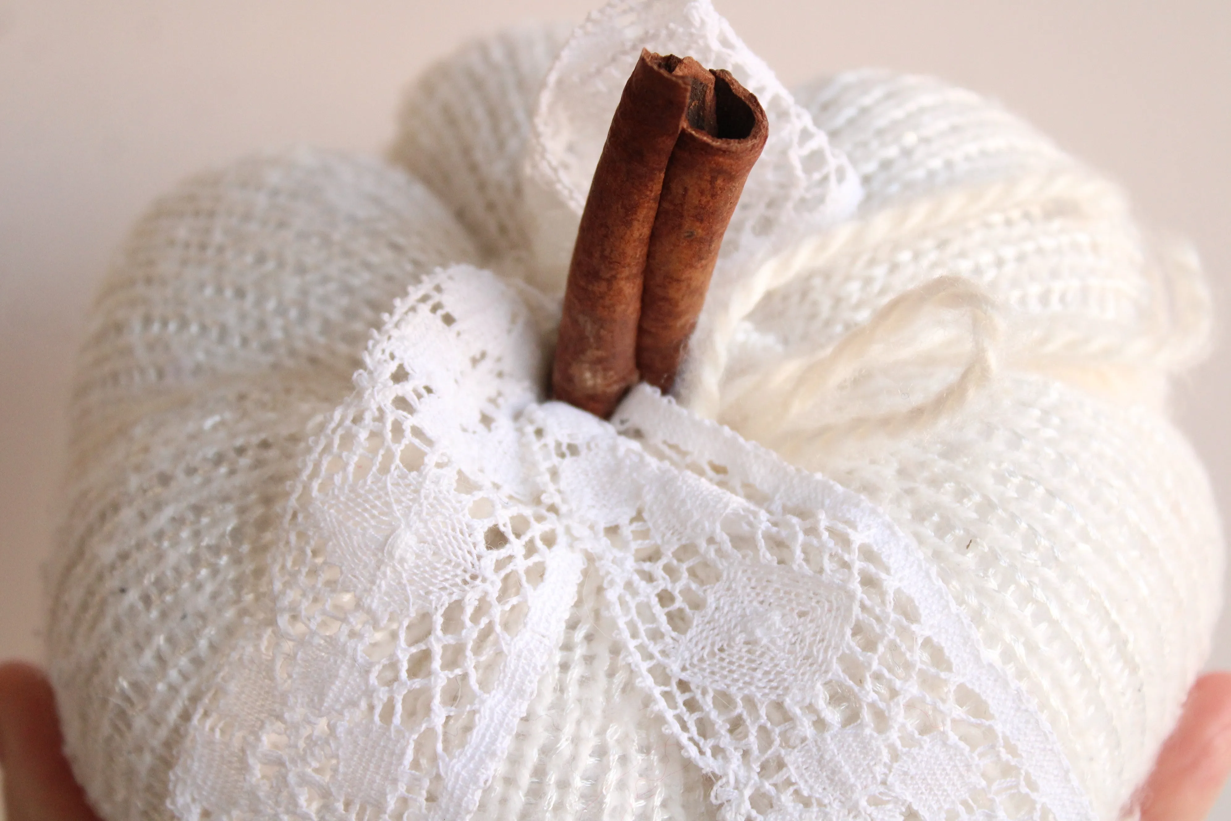 Creamy White Knit Pumpkin PIllow Pouf with Vintage Lace And Cinnamon Stick Stem